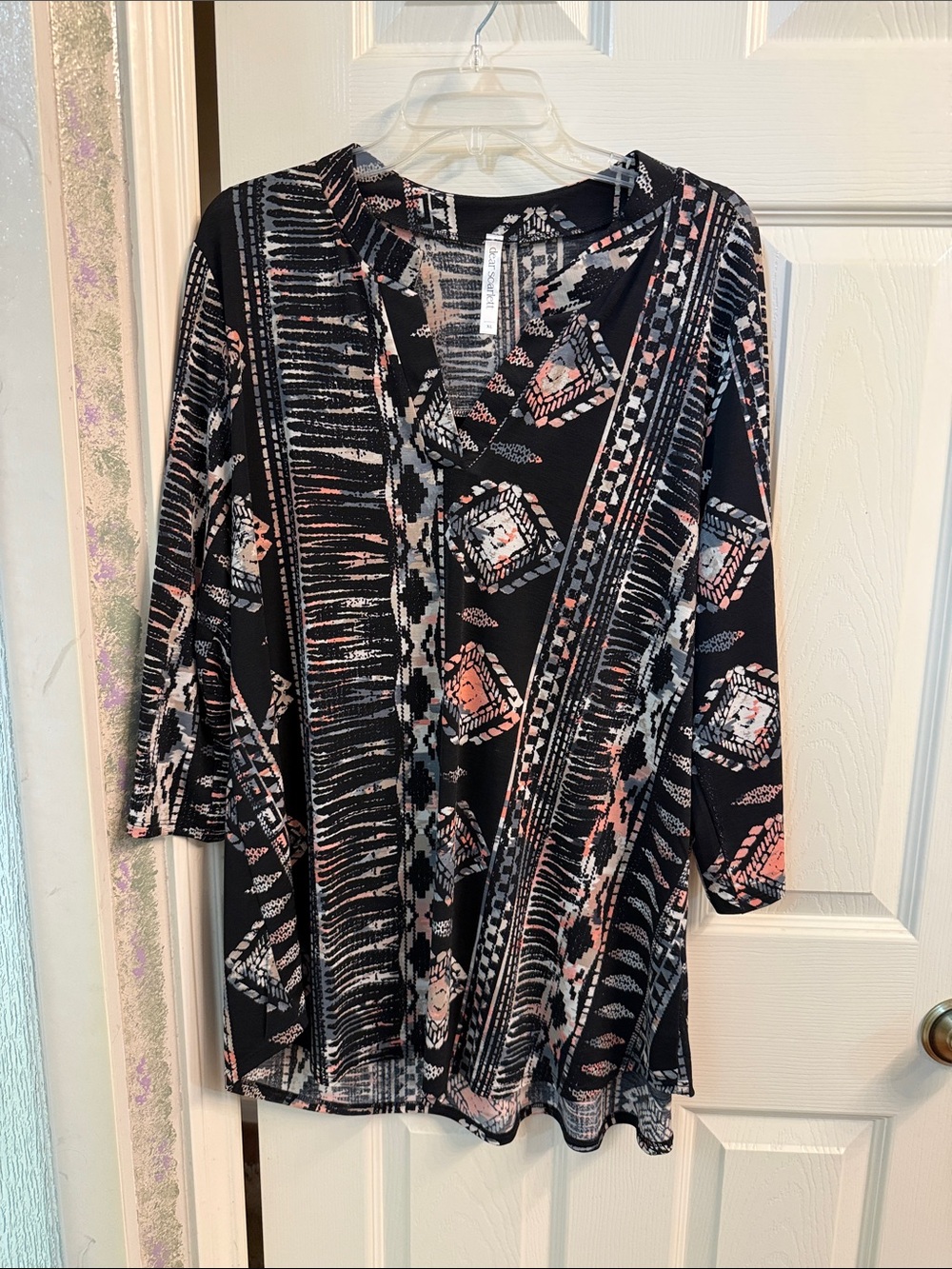 Black Printed V‑Neck Tunic with Pink and Cream Geometric Accents